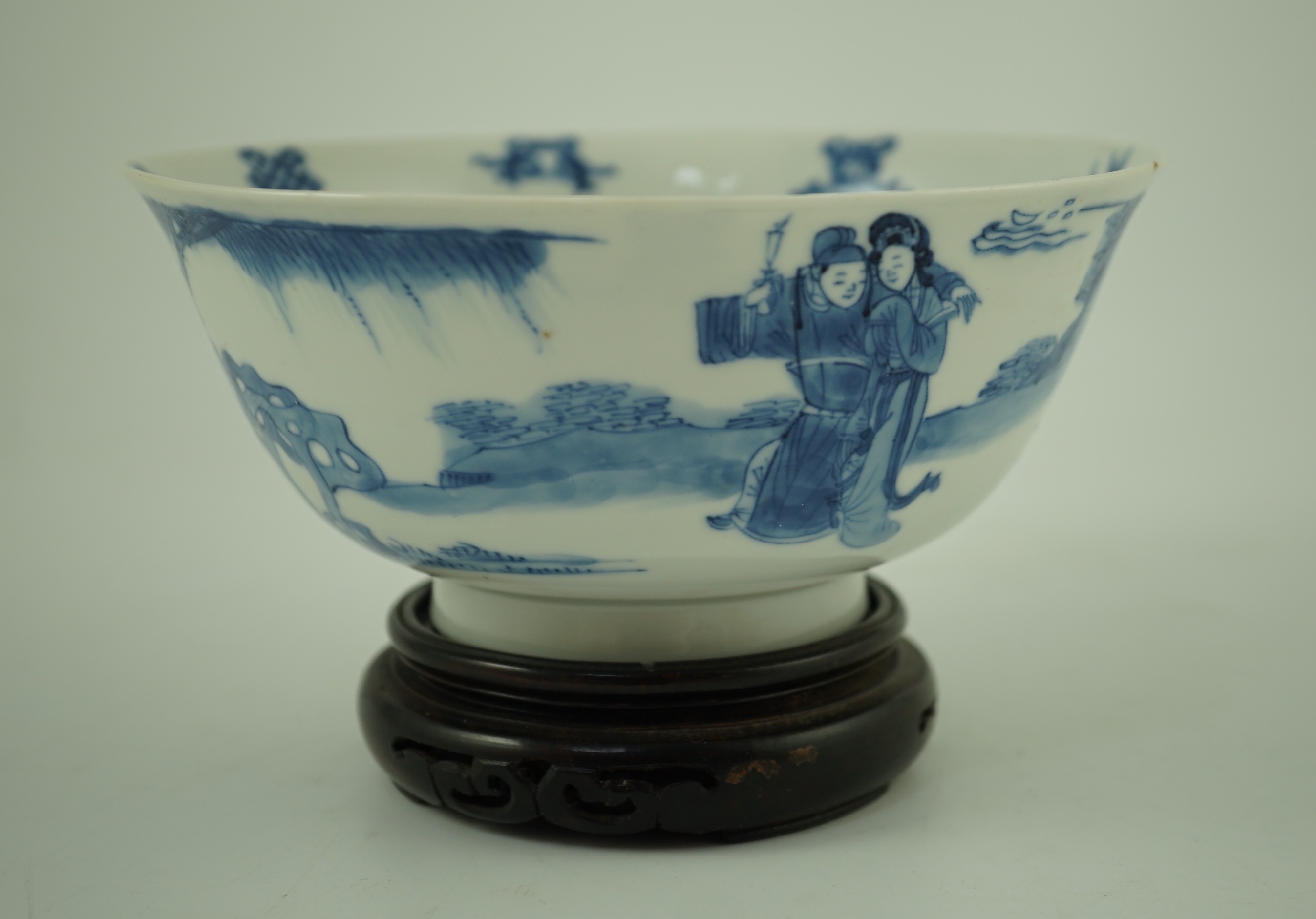 A Chinese blue and white ‘ladies’ bowl, Kangxi period, 15.5cm diameter, wood stand